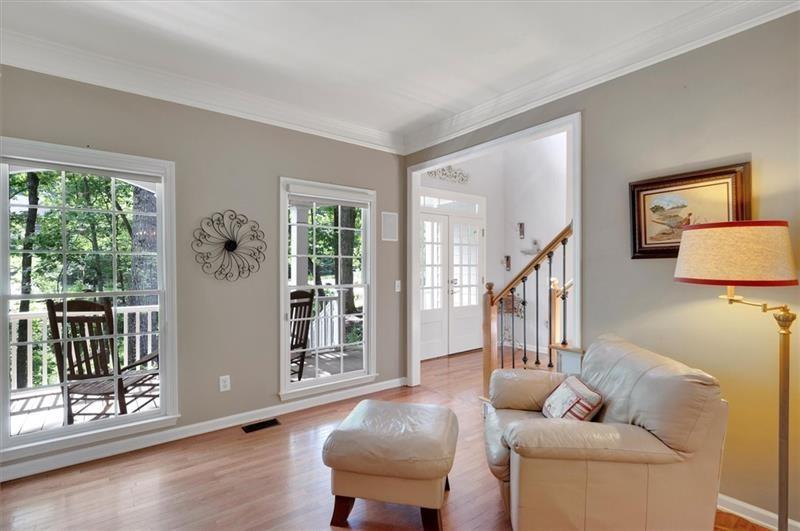1170 Spring Oak Way Cumming, GA 30041 - Photo 12 of 77 a living room with furniture and a window