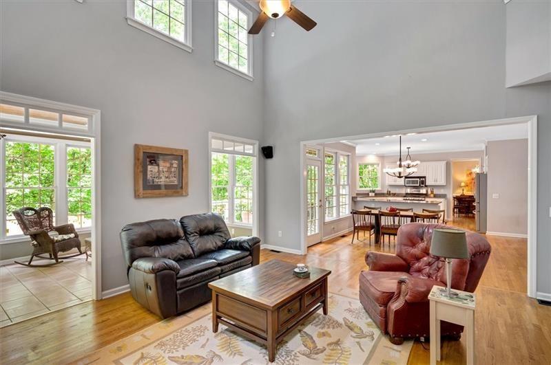 1170 Spring Oak Way Cumming, GA 30041 - Photo 26 of 77 a living room with furniture and a large window