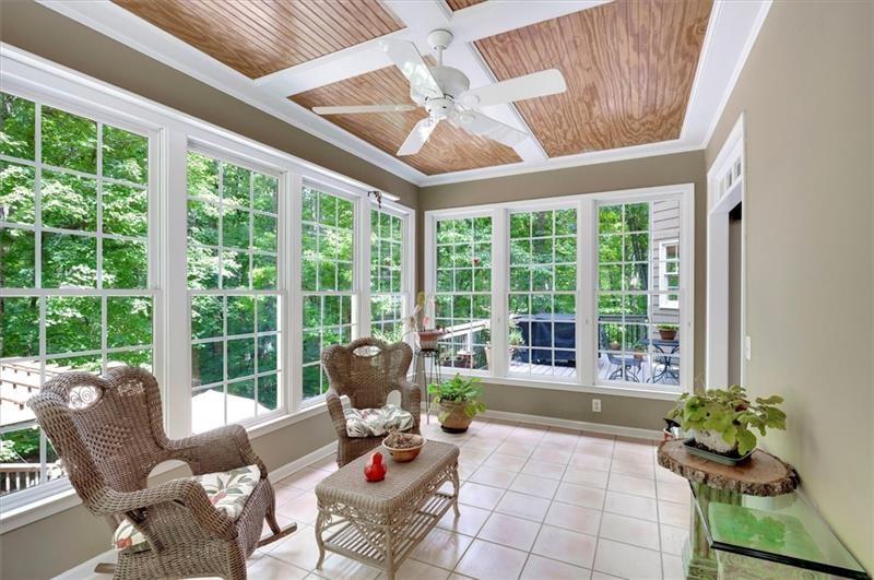 1170 Spring Oak Way Cumming, GA 30041 - Photo 27 of 77 a living room filled with furniture and a potted plant