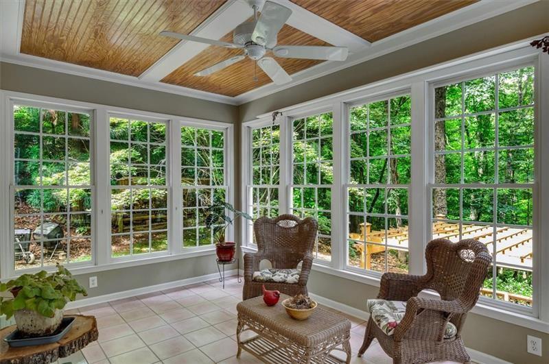 1170 Spring Oak Way Cumming, GA 30041 - Photo 28 of 77 a living room filled with furniture and a large window