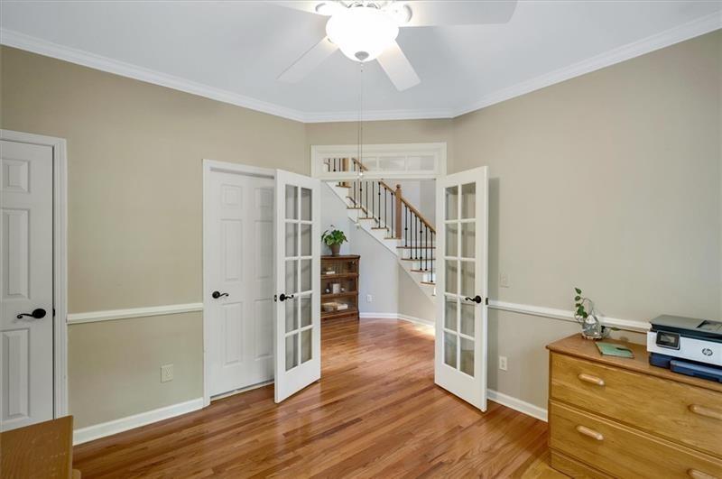 1170 Spring Oak Way Cumming, GA 30041 - Photo 29 of 77 a view of a livingroom with wooden floor and entryway