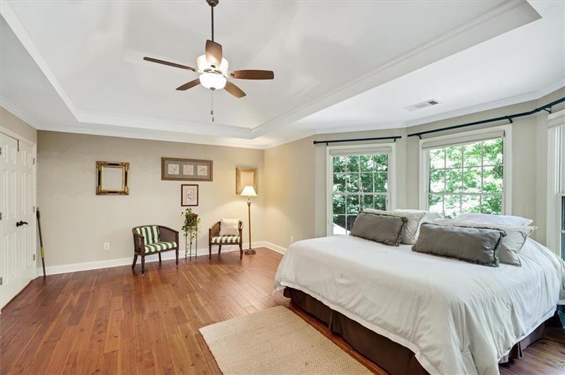 1170 Spring Oak Way Cumming, GA 30041 - Photo 34 of 77 a bedroom with a bed and a table