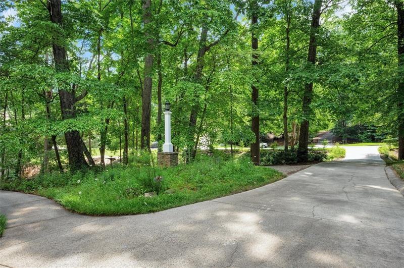 1170 Spring Oak Way Cumming, GA 30041 - Photo 4 of 77 a view of a swimming pool in a yard