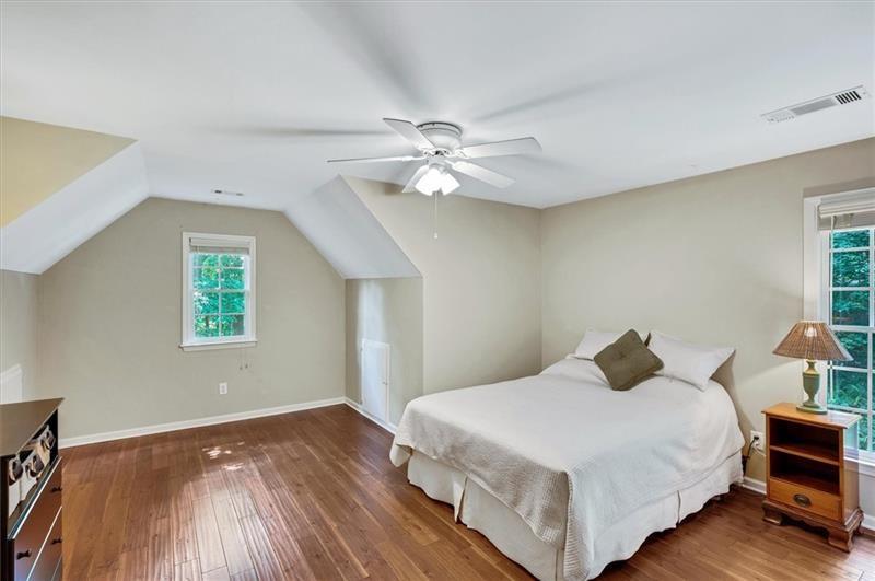 1170 Spring Oak Way Cumming, GA 30041 - Photo 41 of 77 a bedroom with a bed and a ceiling fan