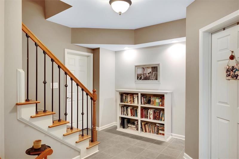 1170 Spring Oak Way Cumming, GA 30041 - Photo 46 of 77 a view of staircase with white walls and a window