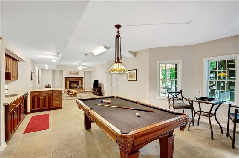 1170 Spring Oak Way Cumming, GA 30041 - Photo 48 of 77 a room with furniture pool table table and chairs
