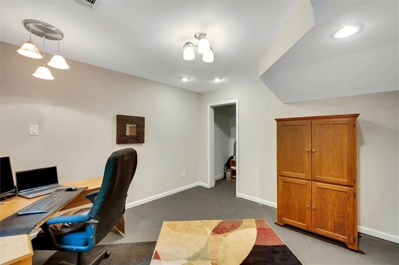 1170 Spring Oak Way Cumming, GA 30041 - Photo 53 of 77 a view of a workspace with furniture and a chandelier