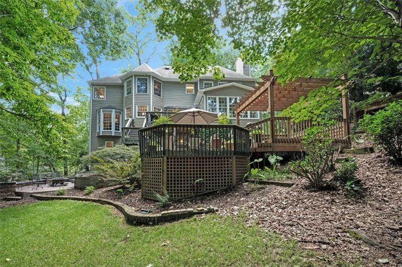1170 Spring Oak Way Cumming, GA 30041 - Photo 58 of 77 a front view of a house with a yard