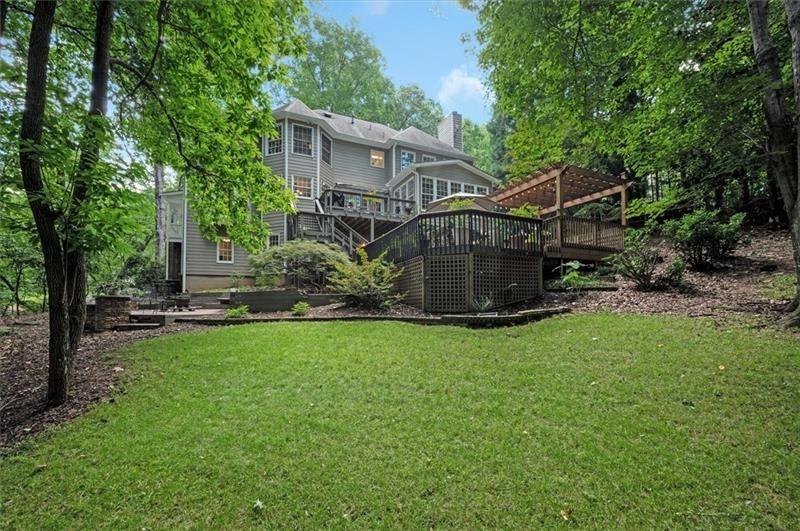 1170 Spring Oak Way Cumming, GA 30041 - Photo 64 of 77 a view of a house with backyard and garden