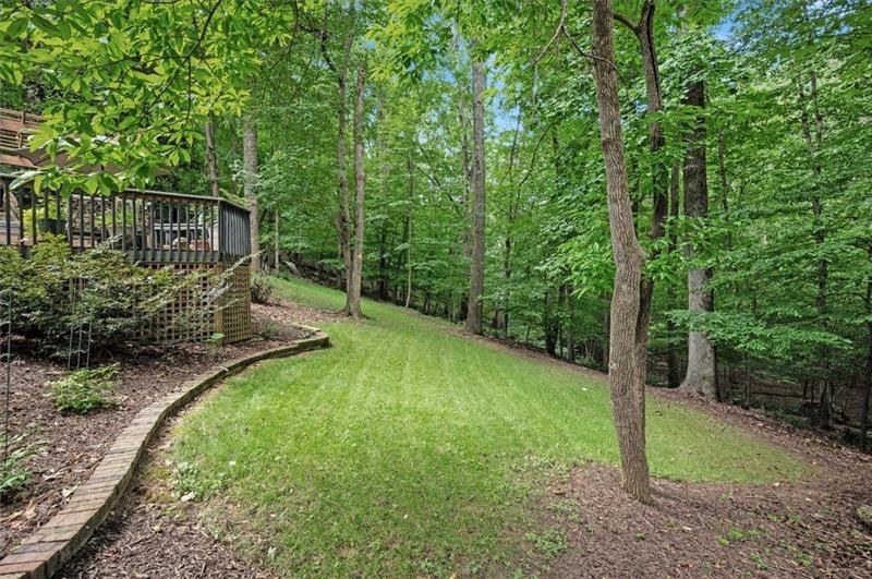 1170 Spring Oak Way Cumming, GA 30041 - Photo 65 of 77 a view of a backyard with a trees