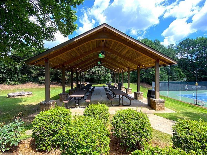 1170 Spring Oak Way Cumming, GA 30041 - Photo 74 of 77 a view of a backyard with sitting area