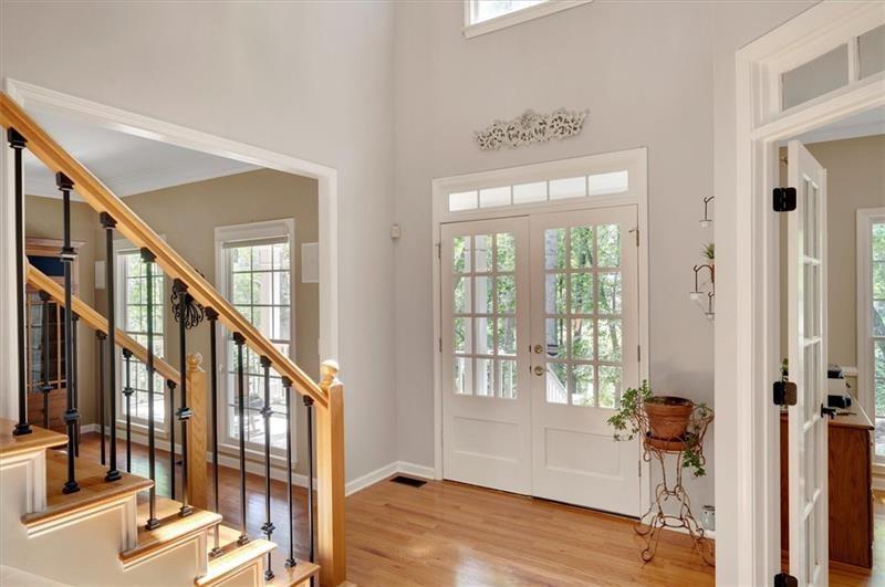 1170 Spring Oak Way Cumming, GA 30041 - Photo 9 of 77 a view of an entryway with wooden floor and windows