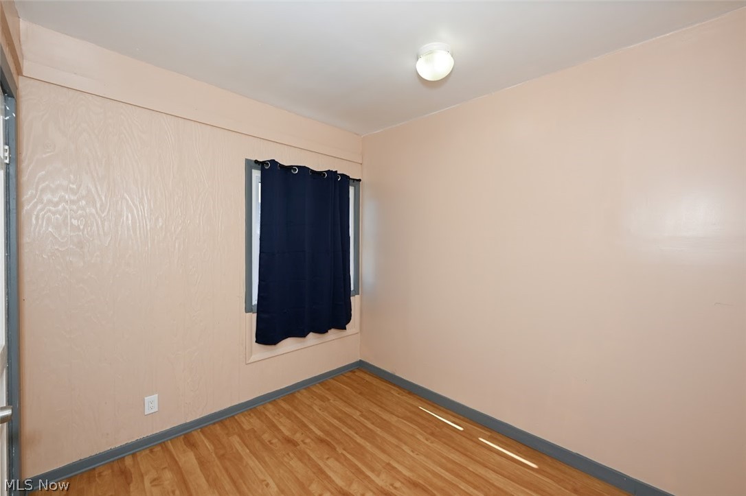 868 North Main Street Akron, OH 44310 - Photo 23 of 30 Unfurnished room featuring light wood-style flooring and baseboards