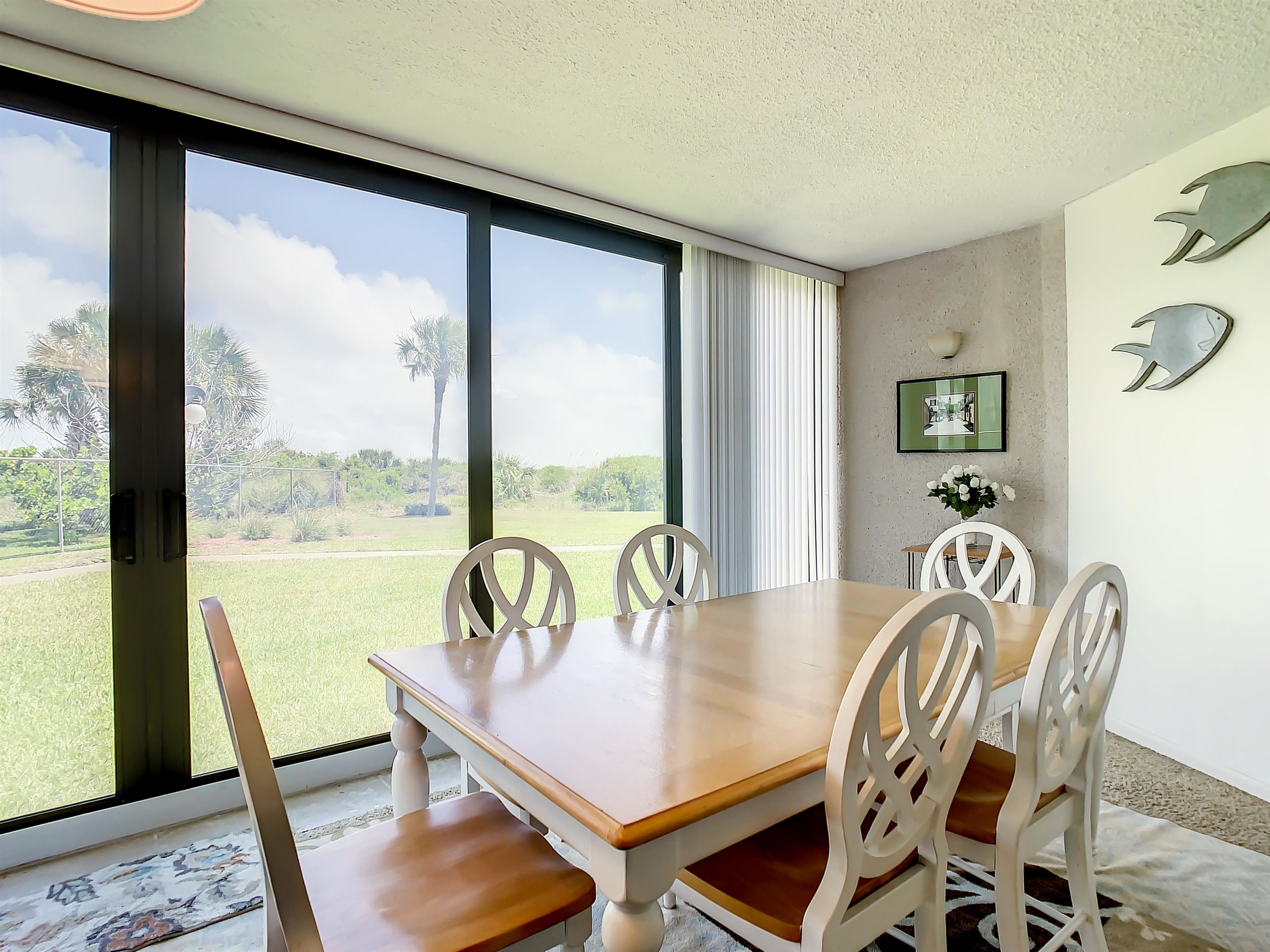 2 Dondanville Road, Unit 110 St. Augustine, FL 32080 - Photo 16 of 38 a view of a dining room with furniture window and wooden floor