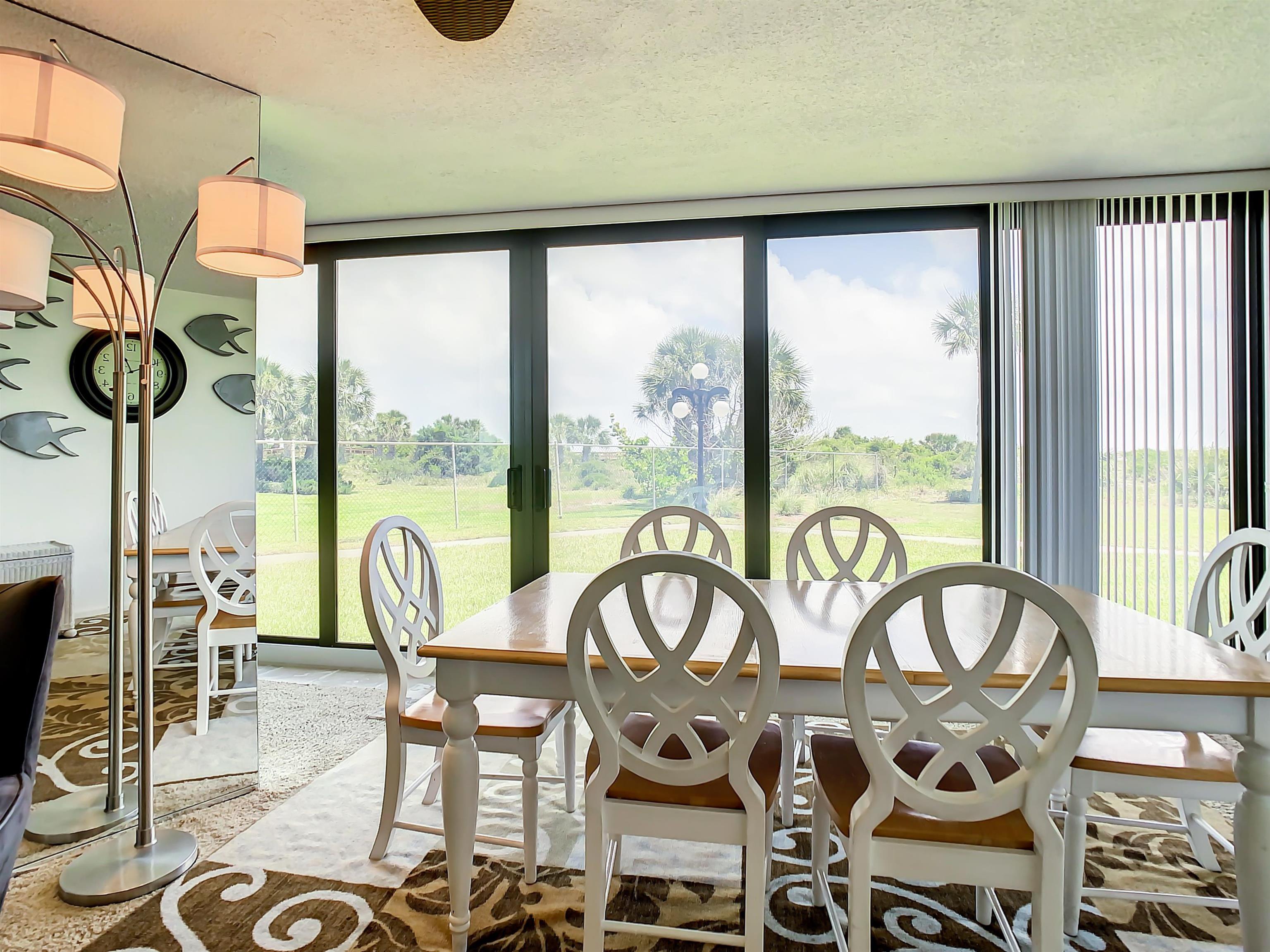 2 Dondanville Road, Unit 110 St. Augustine, FL 32080 - Photo 18 of 38 a view of a patio with table and chairs