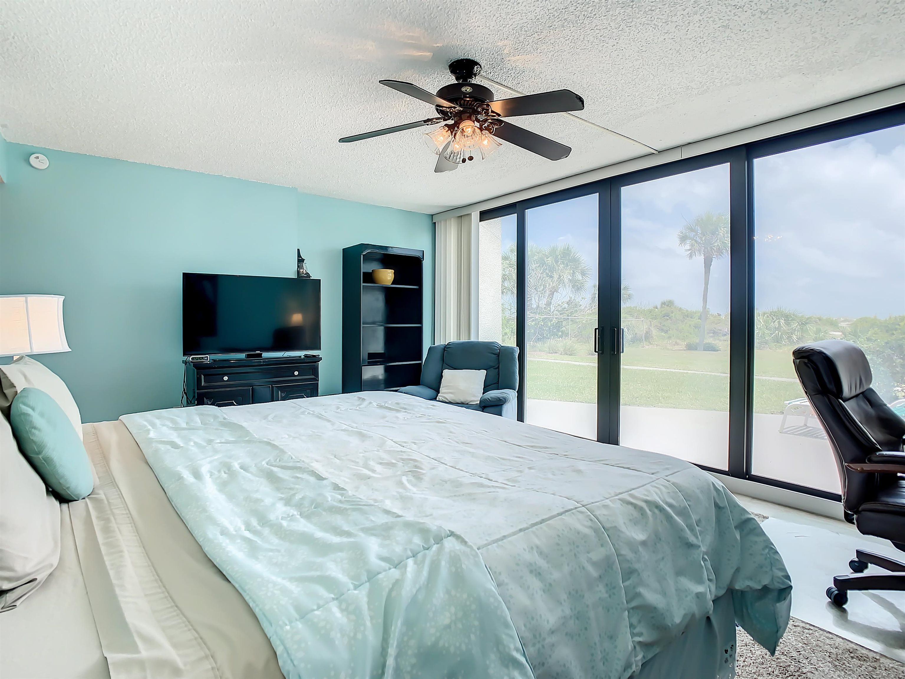 2 Dondanville Road, Unit 110 St. Augustine, FL 32080 - Photo 19 of 38 a bedroom with a bed and a flat screen tv