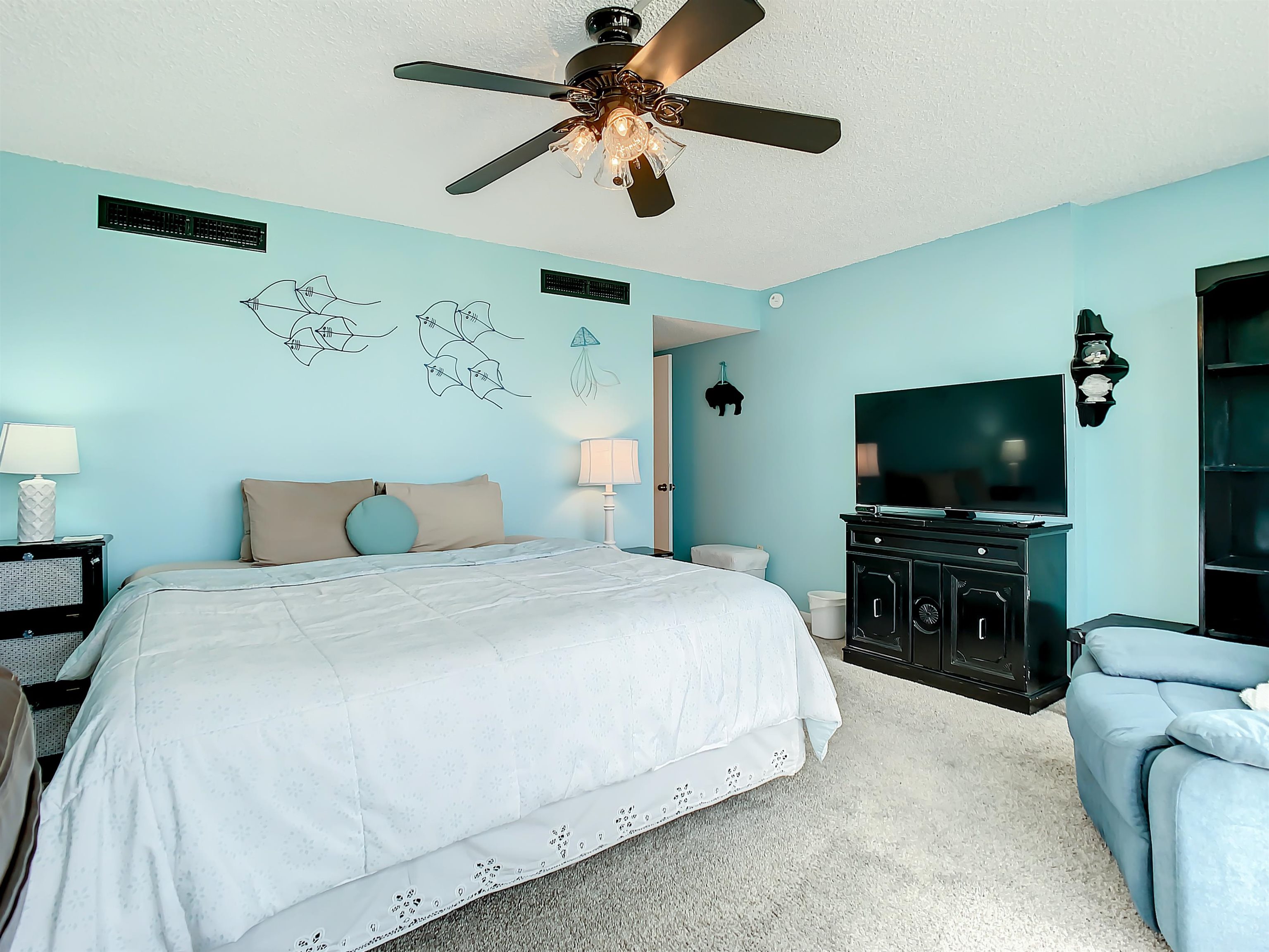 2 Dondanville Road, Unit 110 St. Augustine, FL 32080 - Photo 20 of 38 a bedroom with a bed and a flat screen tv