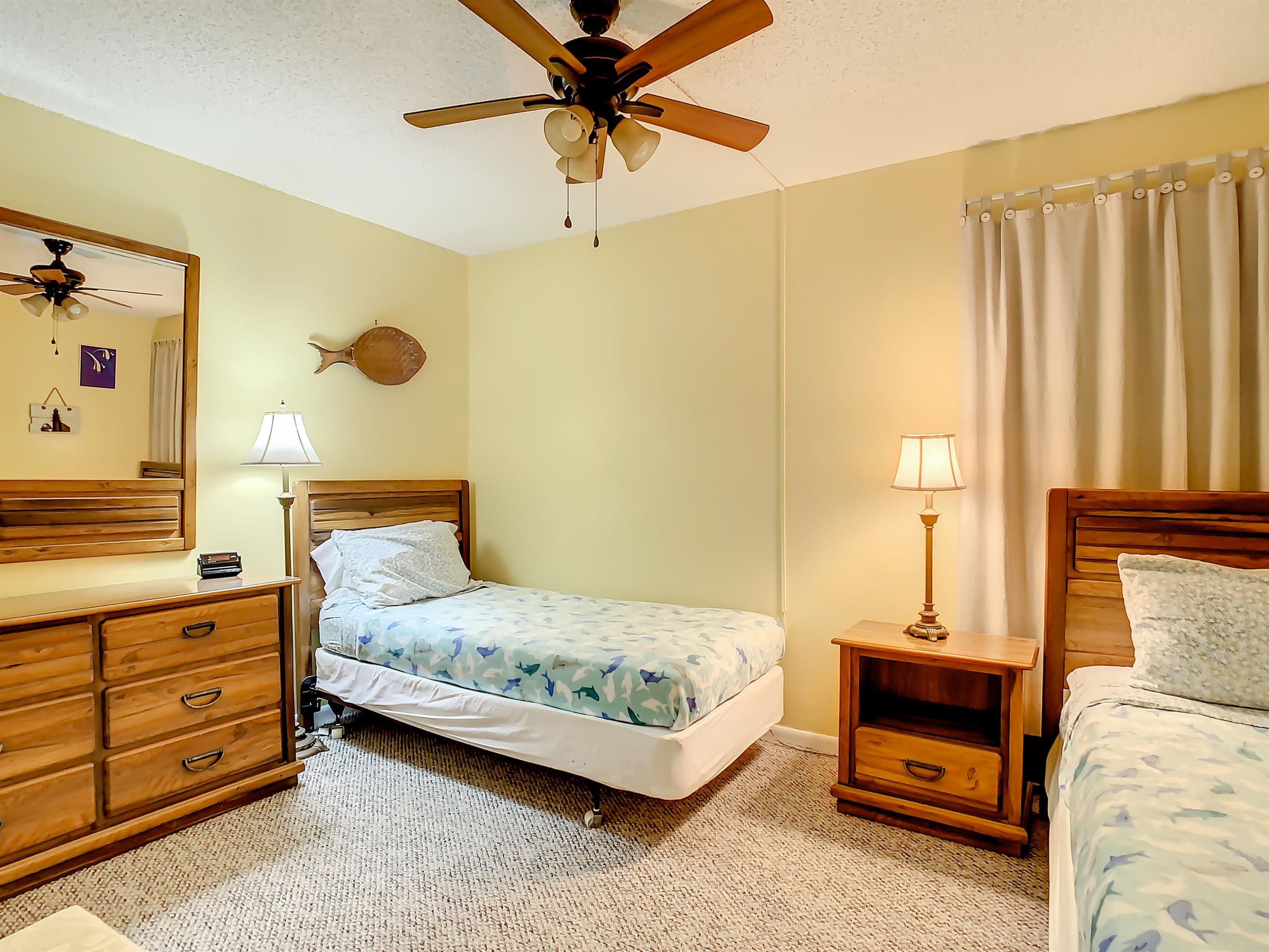 2 Dondanville Road, Unit 110 St. Augustine, FL 32080 - Photo 30 of 38 a bedroom with a bed lamp and a window