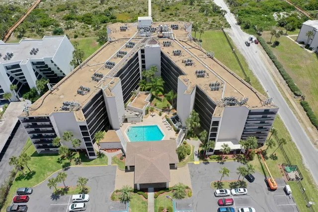 an aerial view of a house with outdoor space