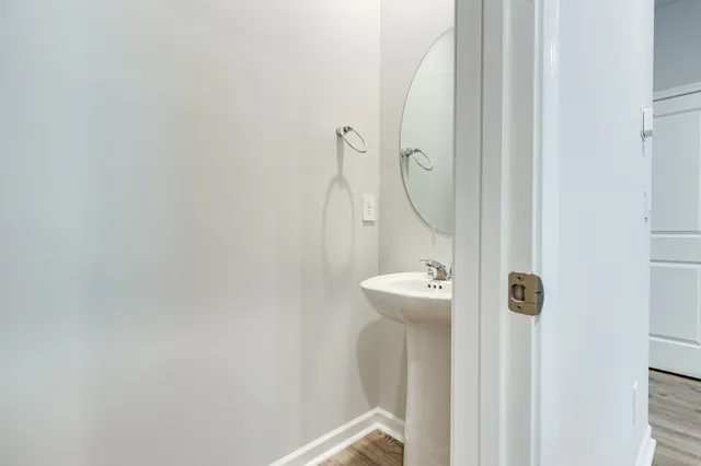 a bathroom with a sink and mirror