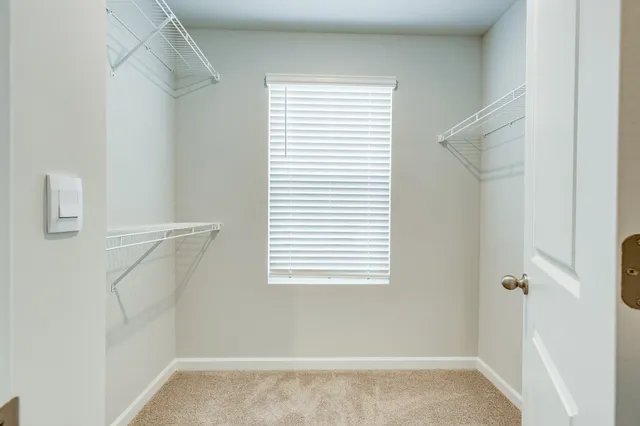 a view of a room that has a window in it