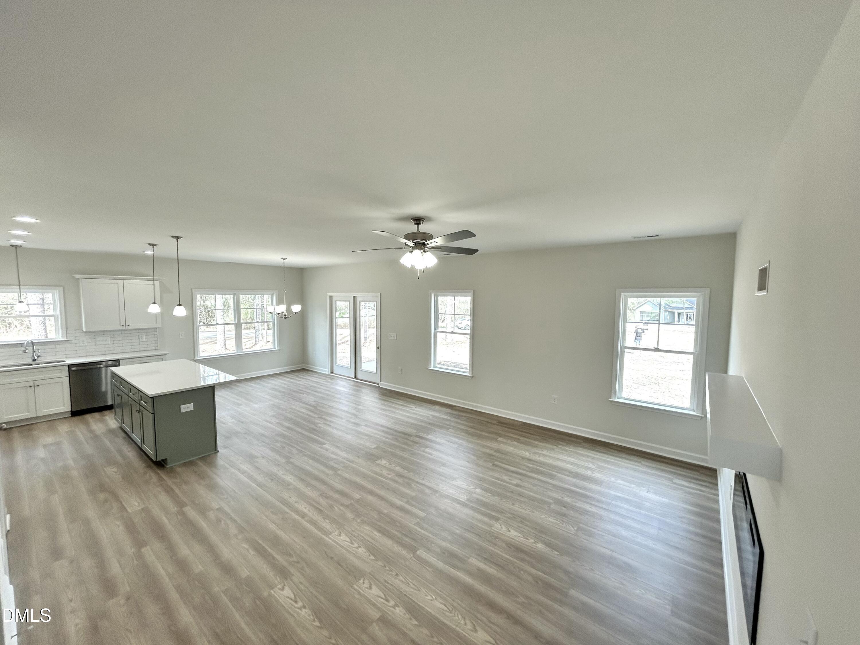 1739 Cardinal Drive Deep Run, NC 28525 - Photo 15 of 29 a view of an empty room with window and wooden floor