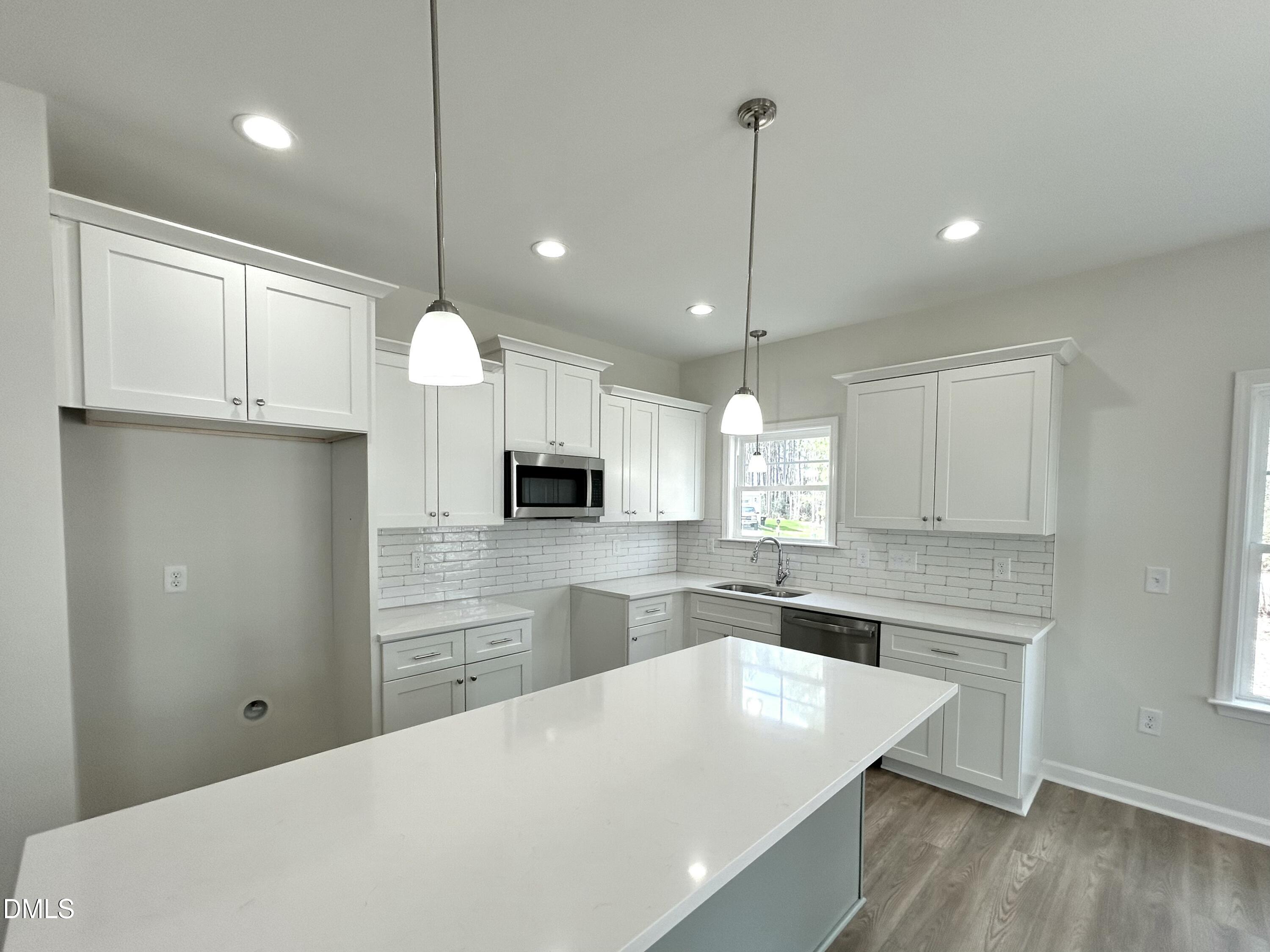 1739 Cardinal Drive Deep Run, NC 28525 - Photo 18 of 29 a large kitchen with cabinets
