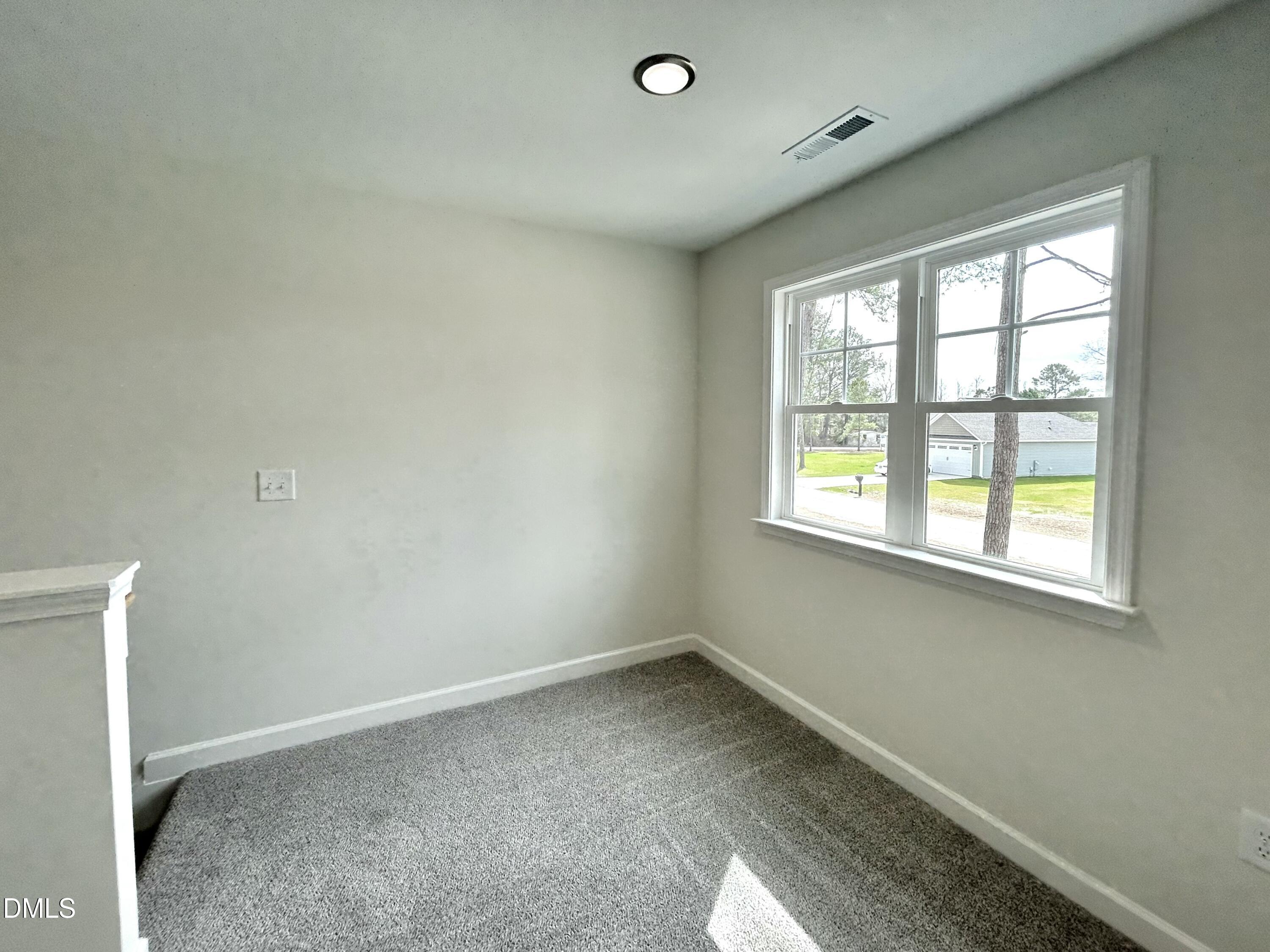 1739 Cardinal Drive Deep Run, NC 28525 - Photo 21 of 29 an empty room with a window