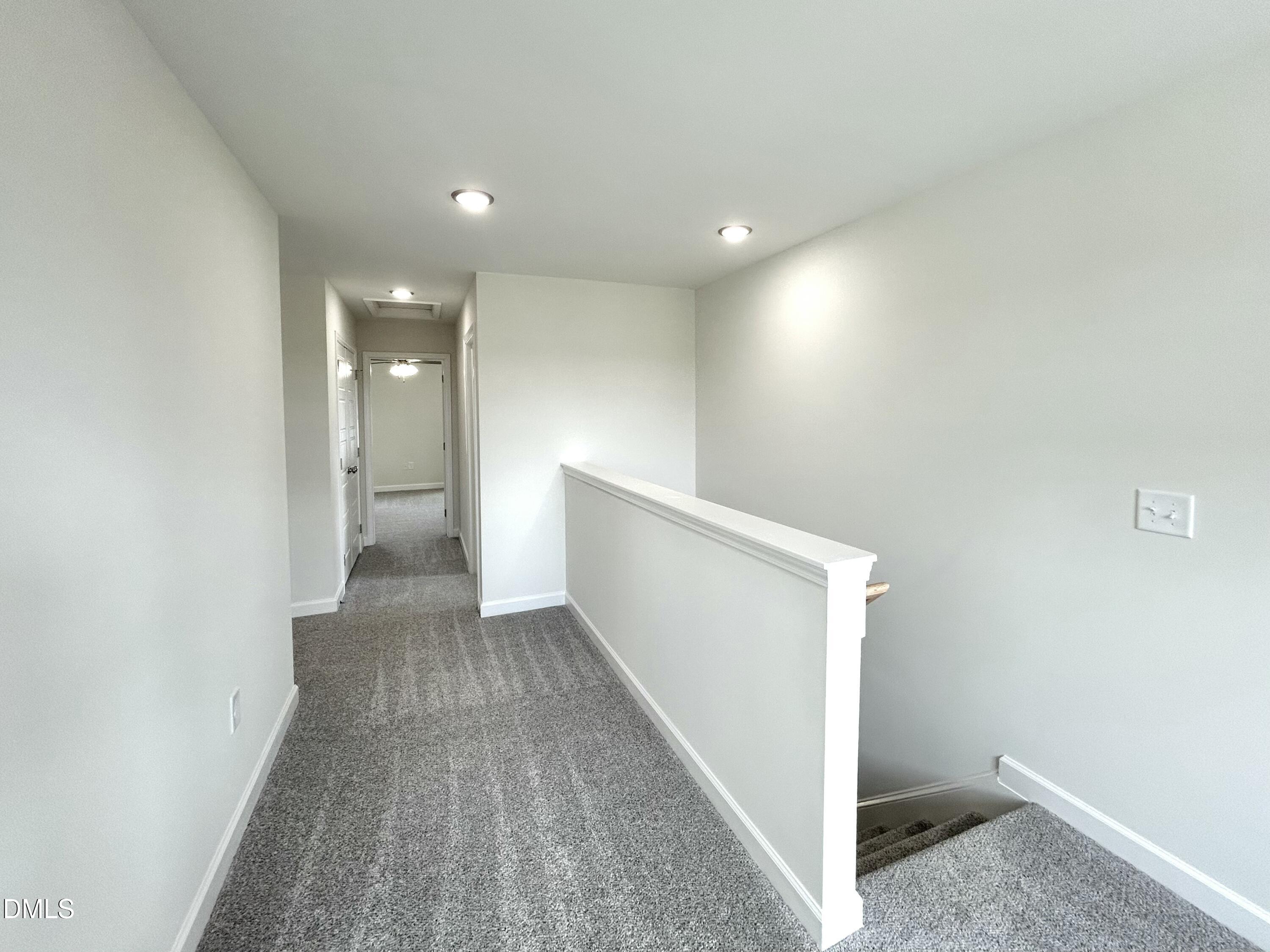 1739 Cardinal Drive Deep Run, NC 28525 - Photo 22 of 29 a view of a hallway with wooden floor