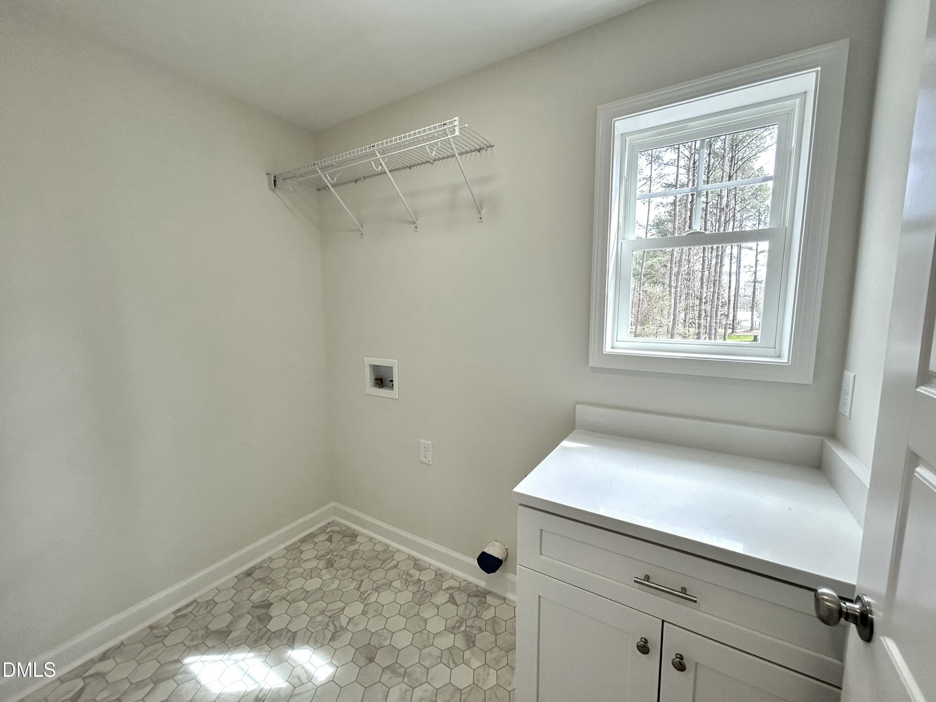 1739 Cardinal Drive Deep Run, NC 28525 - Photo 24 of 29 a bathroom with a window sink and vanity