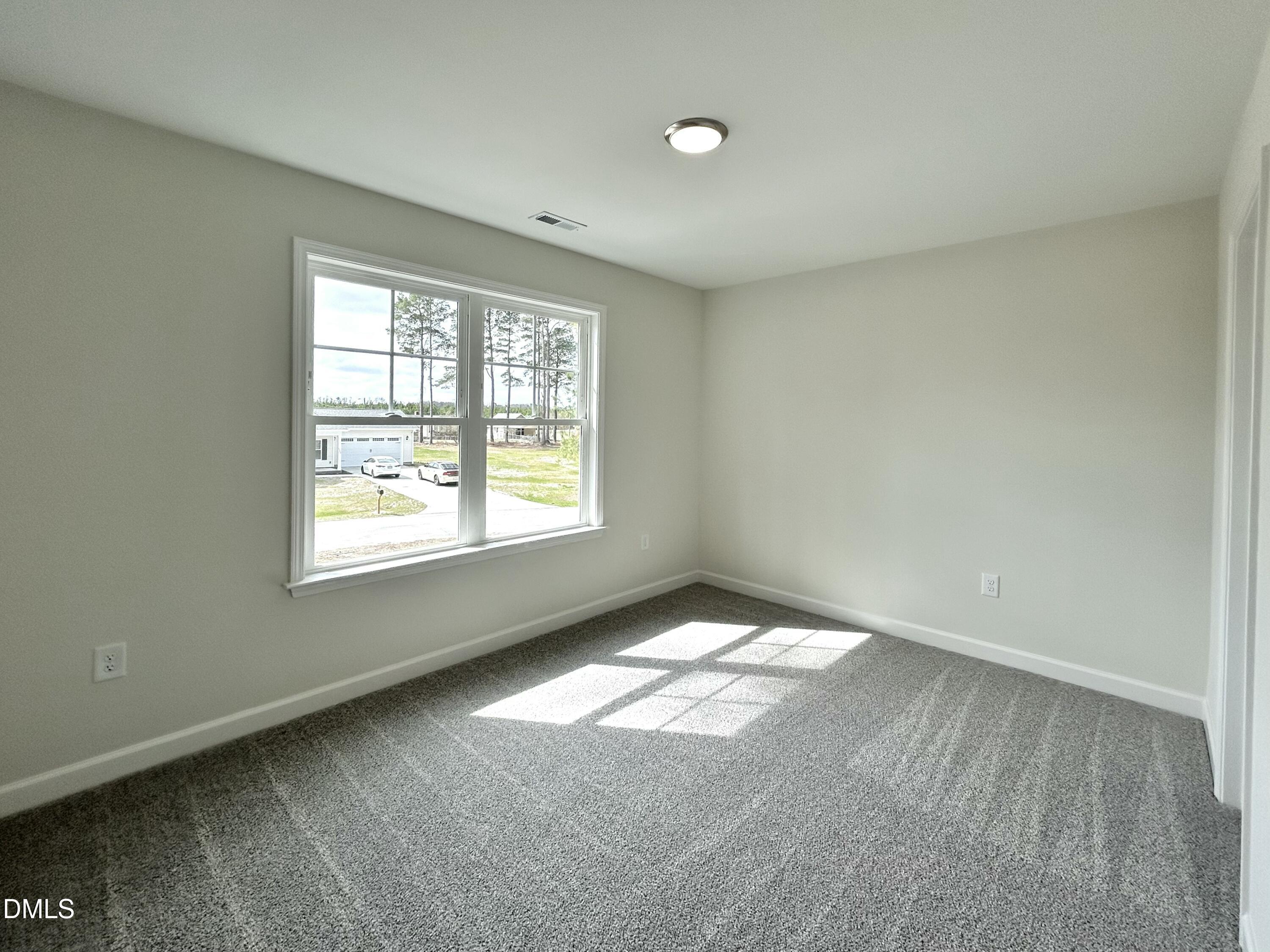 1739 Cardinal Drive Deep Run, NC 28525 - Photo 29 of 29 an empty room with windows