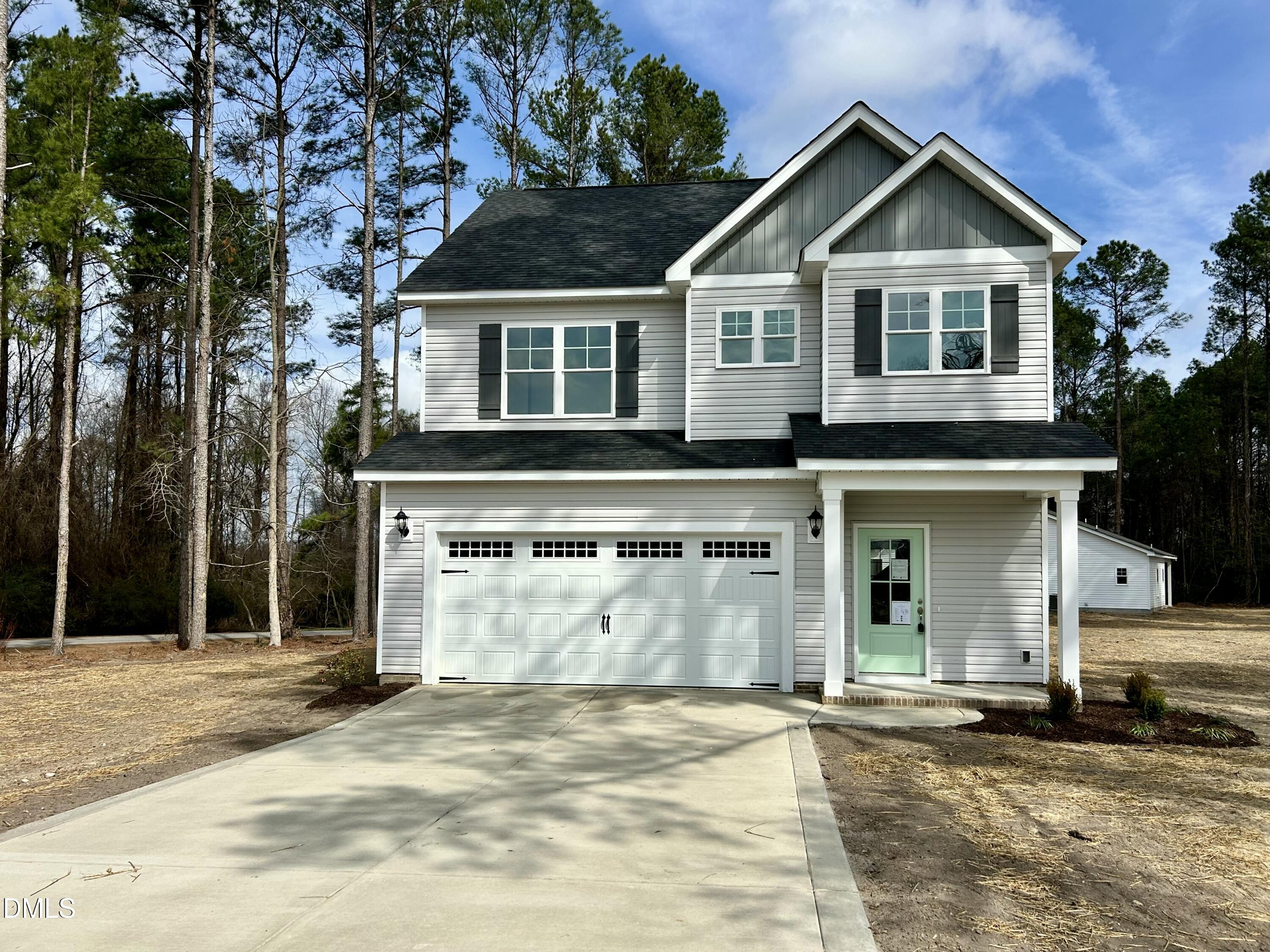 1739 Cardinal Drive Deep Run, NC 28525 - Photo 3 of 29 a front view of a house with a yard and garage