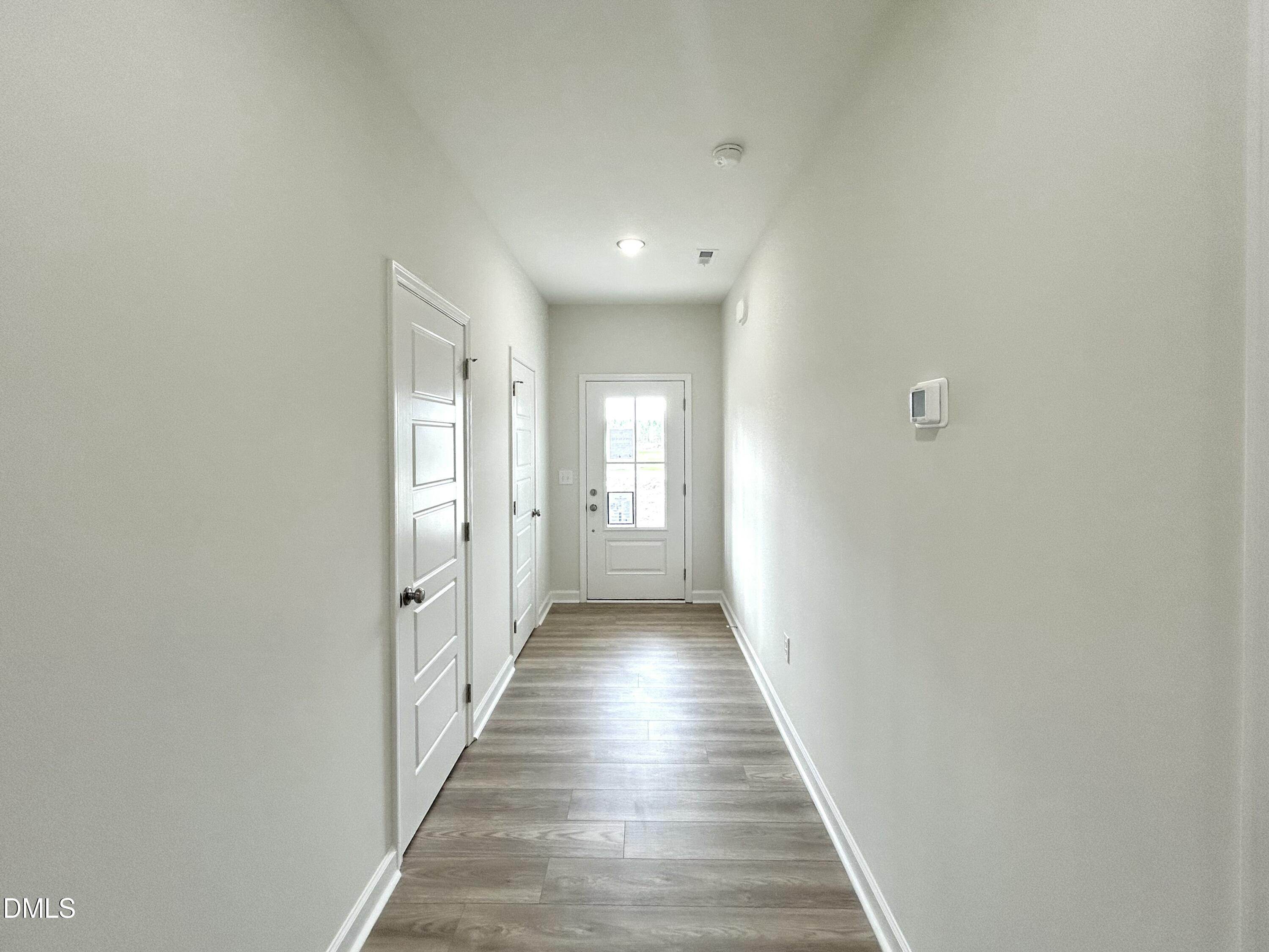 1739 Cardinal Drive Deep Run, NC 28525 - Photo 9 of 29 a view of a hallway with wooden floor