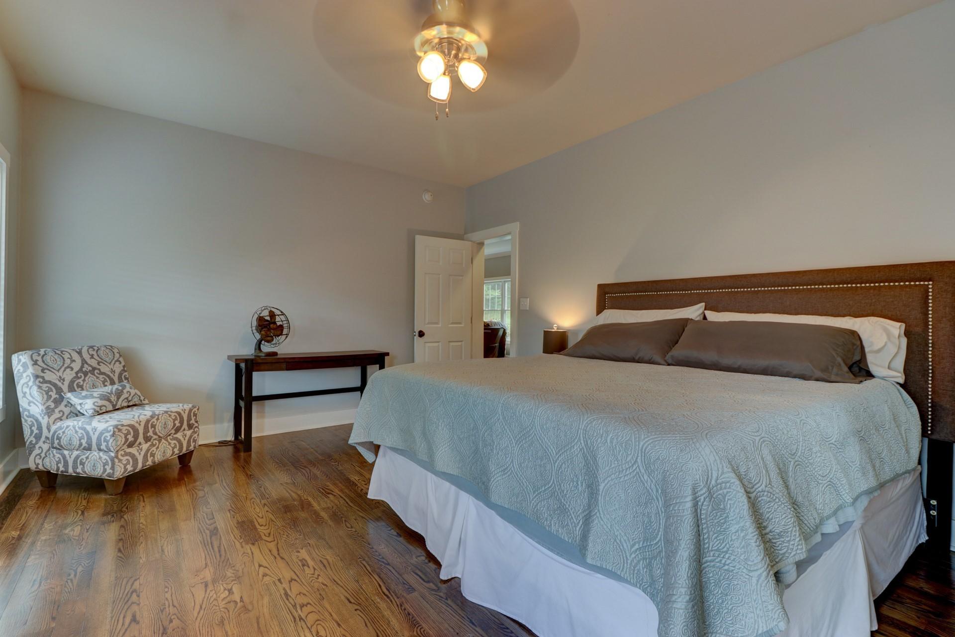 1491 Epperly Mill Road Southwest Floyd, VA 24091 - Photo 18 of 48 a bedroom with a bed and wooden floor