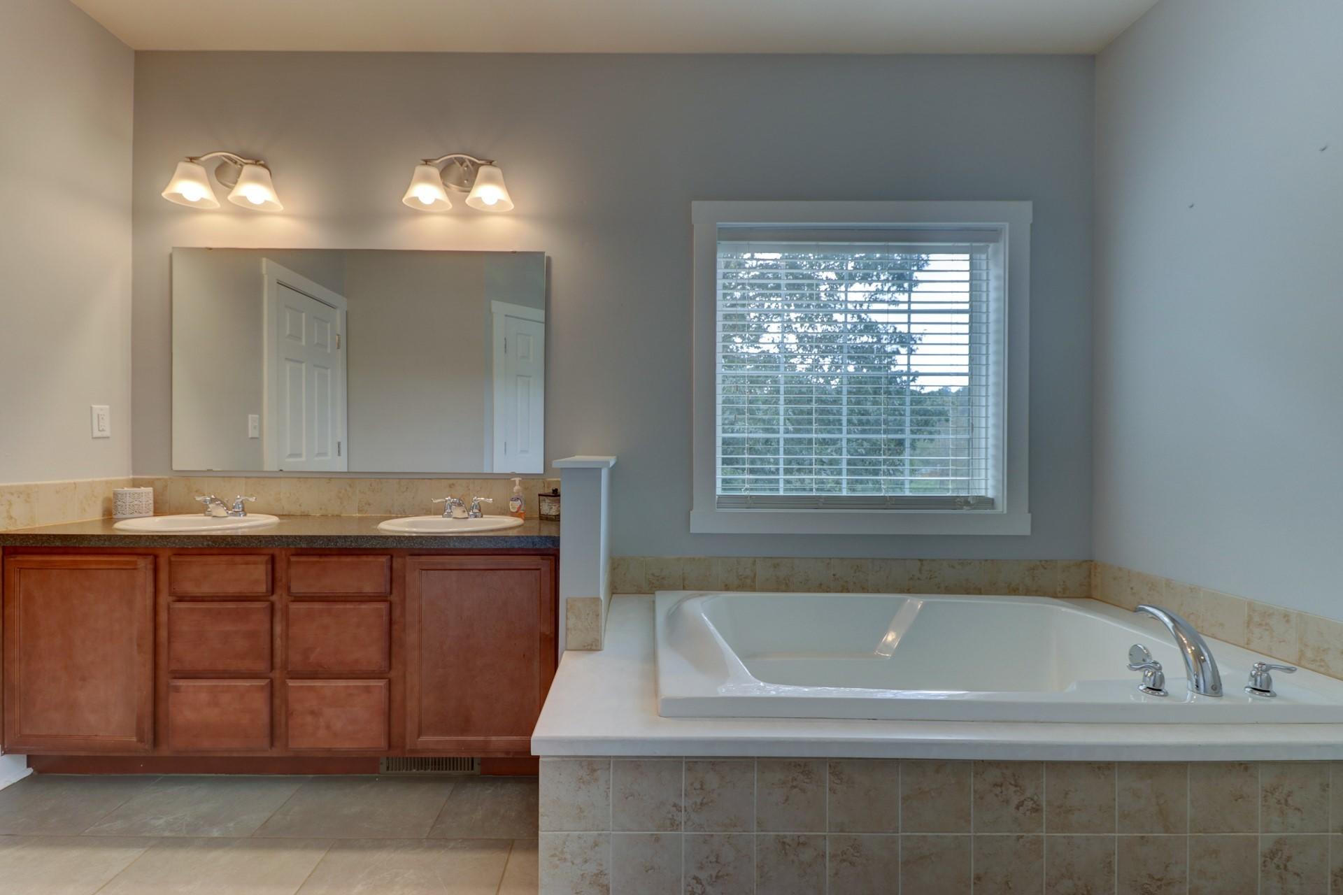 1491 Epperly Mill Road Southwest Floyd, VA 24091 - Photo 19 of 48 a bathroom with a bathtub and a sink