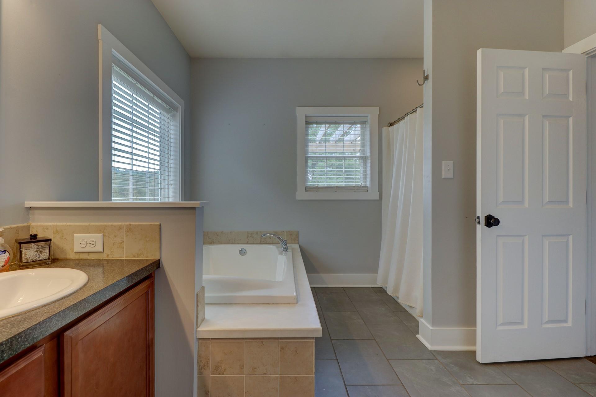 1491 Epperly Mill Road Southwest Floyd, VA 24091 - Photo 20 of 48 a bathroom with a sink toilet and mirror