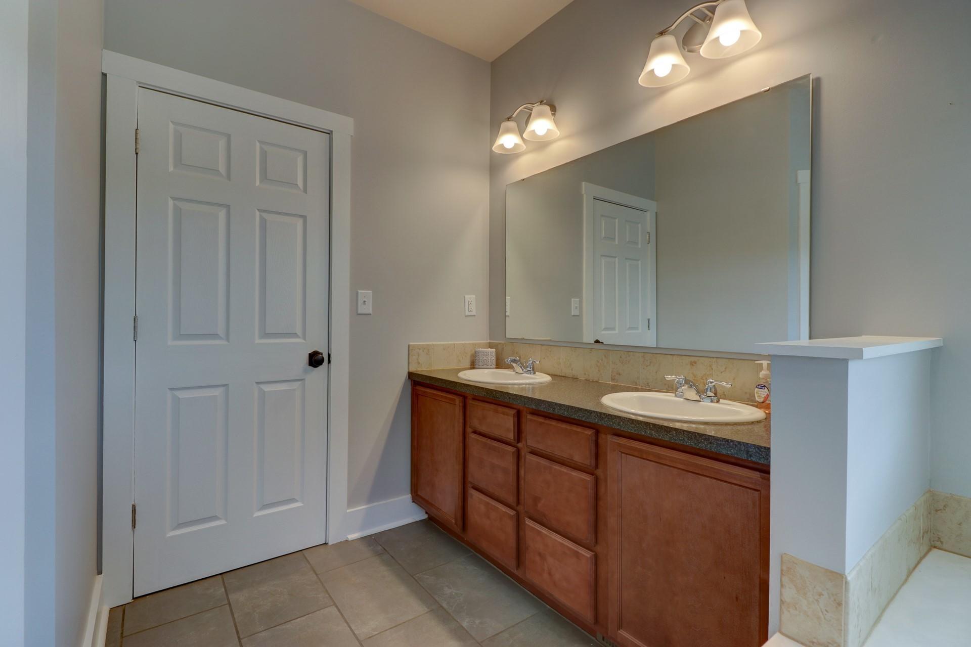 1491 Epperly Mill Road Southwest Floyd, VA 24091 - Photo 21 of 48 a bathroom with a sink and a mirror