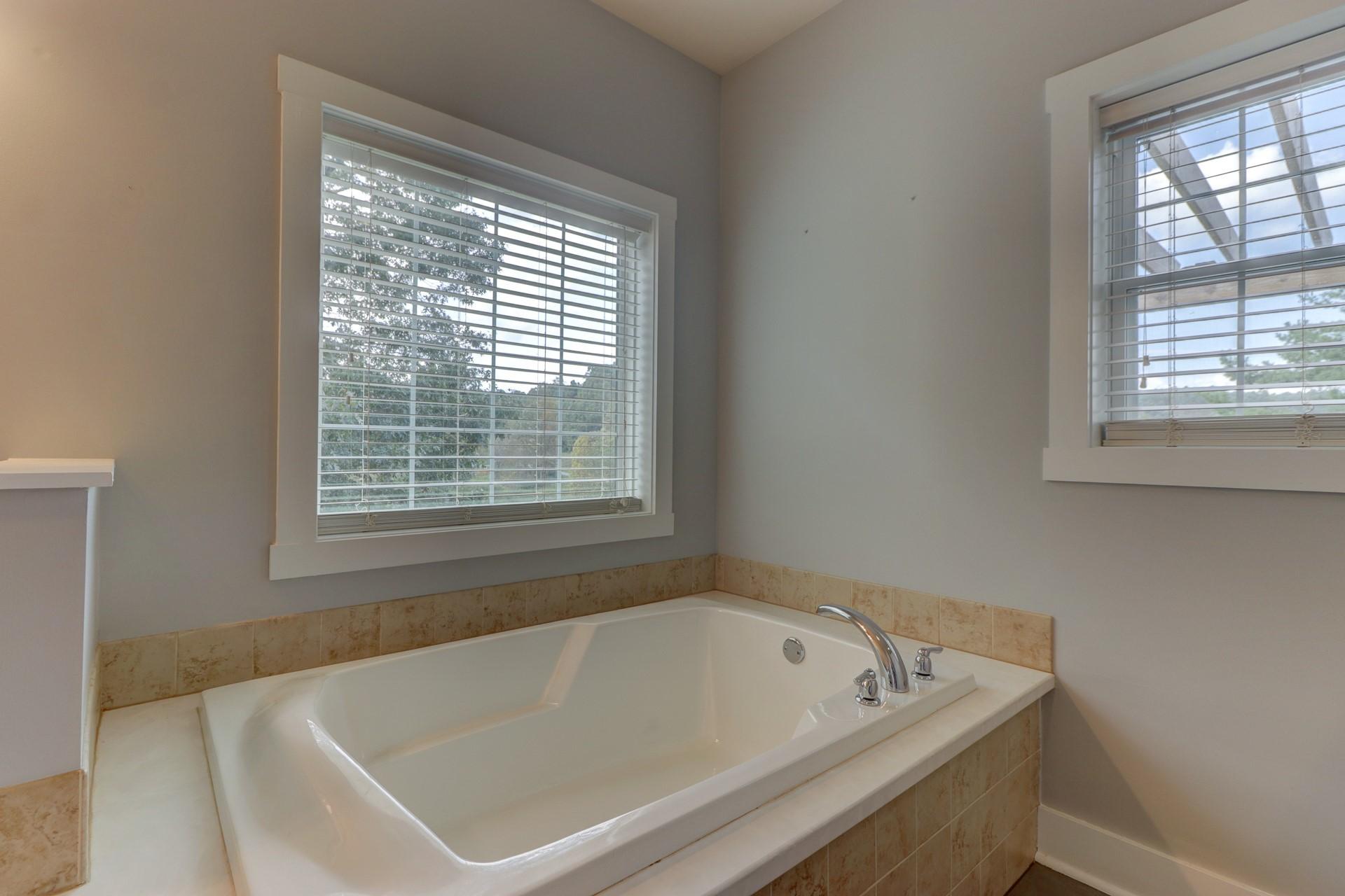 1491 Epperly Mill Road Southwest Floyd, VA 24091 - Photo 22 of 48 a white bath tub sitting next to a window