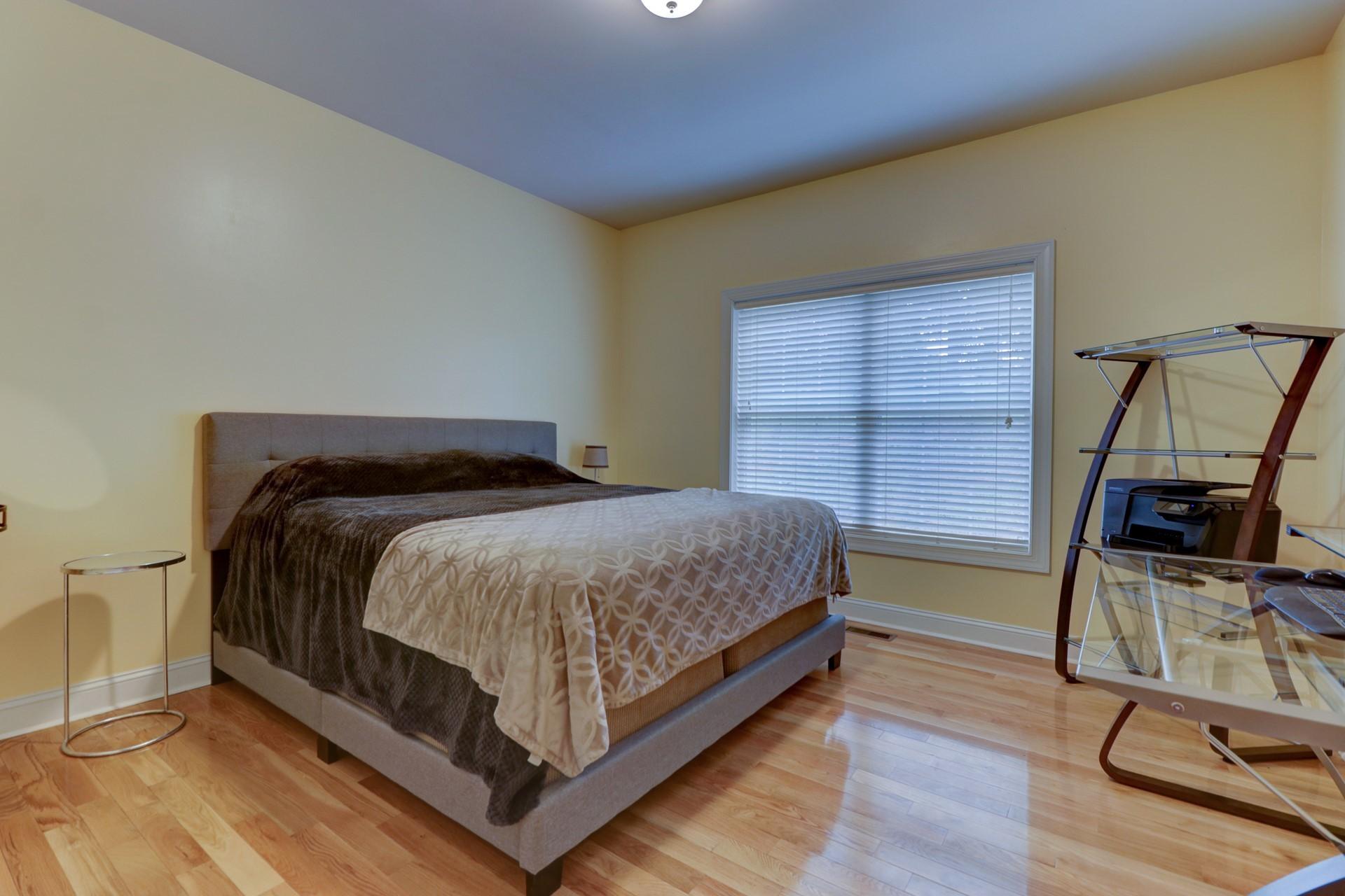 1491 Epperly Mill Road Southwest Floyd, VA 24091 - Photo 24 of 48 a bedroom with a bed a flat screen tv and dresser