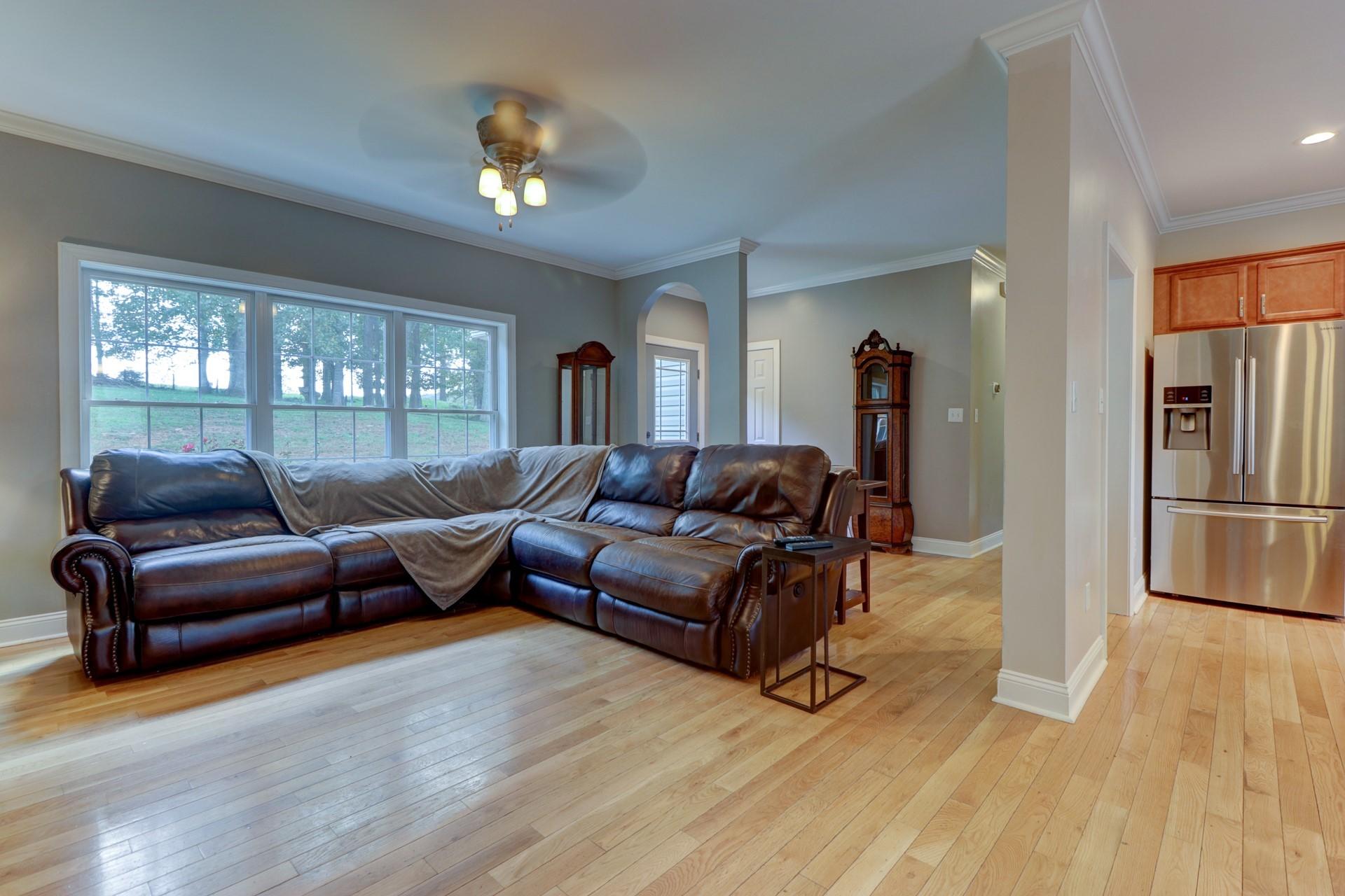 1491 Epperly Mill Road Southwest Floyd, VA 24091 - Photo 5 of 48 a living room with furniture and a chandelier