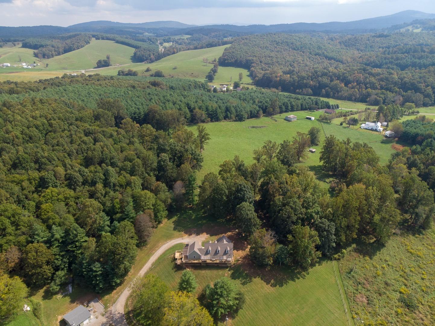 1491 Epperly Mill Road Southwest Floyd, VA 24091 - Photo 42 of 48 a view of a lush green hillside and houses
