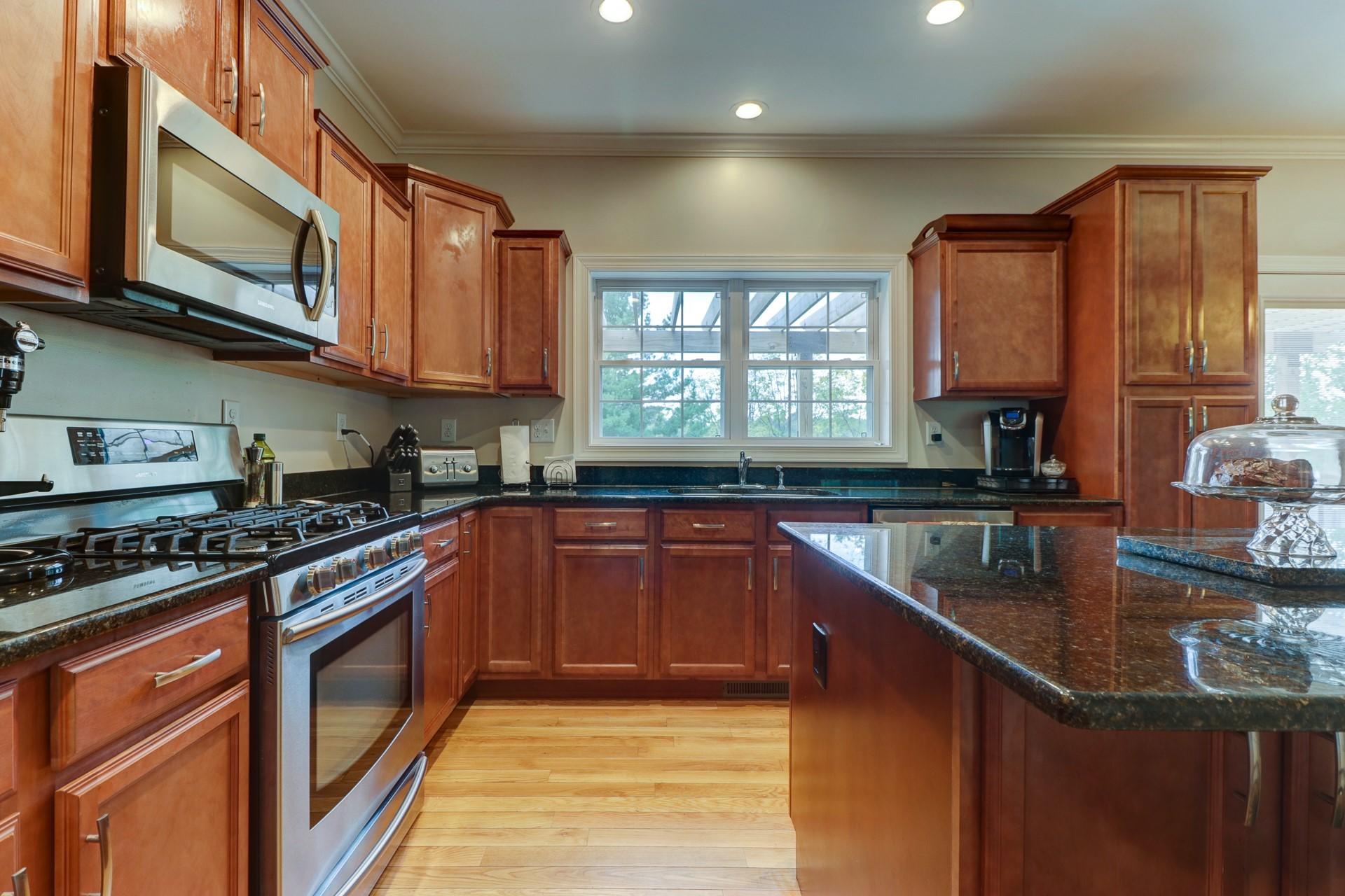 1491 Epperly Mill Road Southwest Floyd, VA 24091 - Photo 7 of 48 a kitchen with stainless steel appliances granite countertop a sink stove and microwave