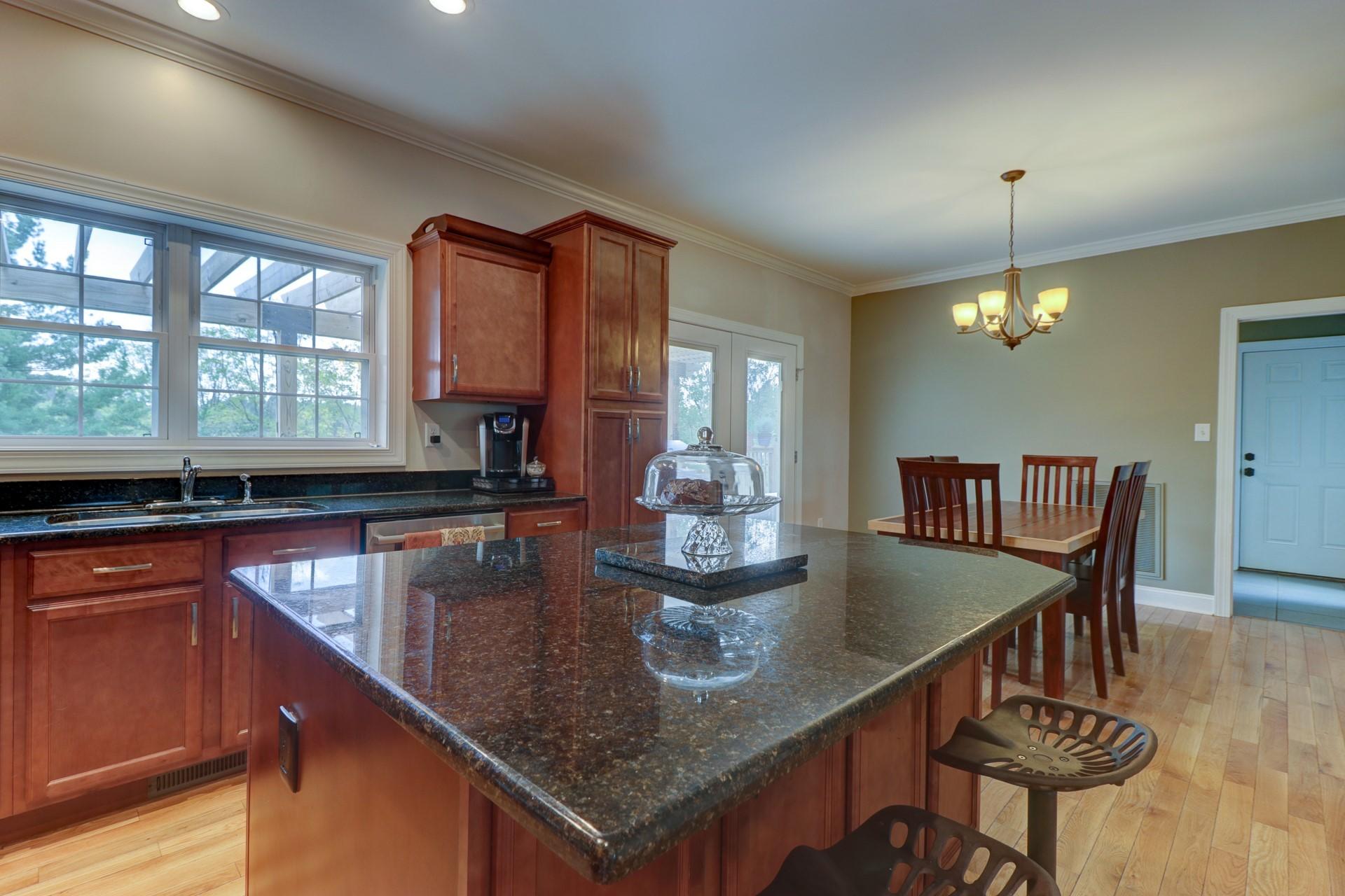 1491 Epperly Mill Road Southwest Floyd, VA 24091 - Photo 8 of 48 a kitchen counter top space dining table chairs and kitchen view