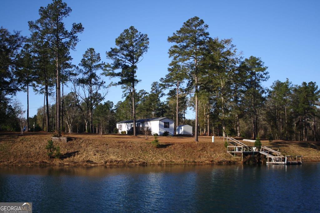 1551 Stills Road Metter, GA 30439 - Photo 1 of 1 a view of a lake with houses