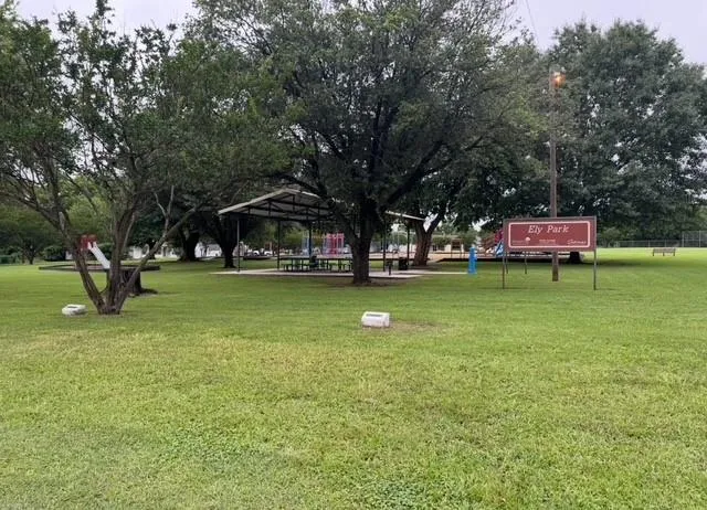 a childrens park with lots of swings and slides