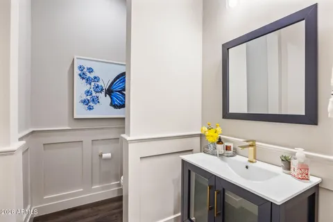 a bathroom with a sink and a mirror