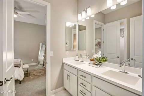 a bathroom with a double vanity sink mirror and double