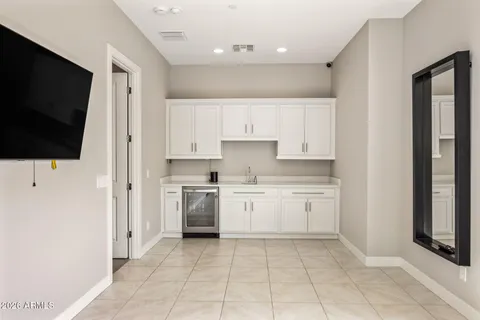 a kitchen with a sink and a stove top oven