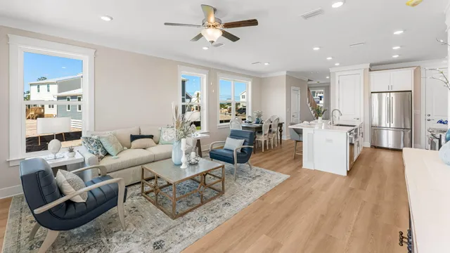 a living room with kitchen island furniture and a wooden floor