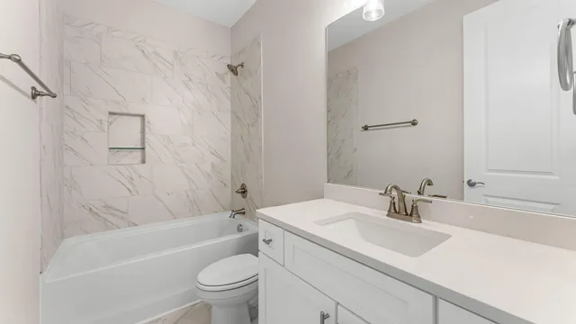 a bathroom with a sink a toilet and a bathtub